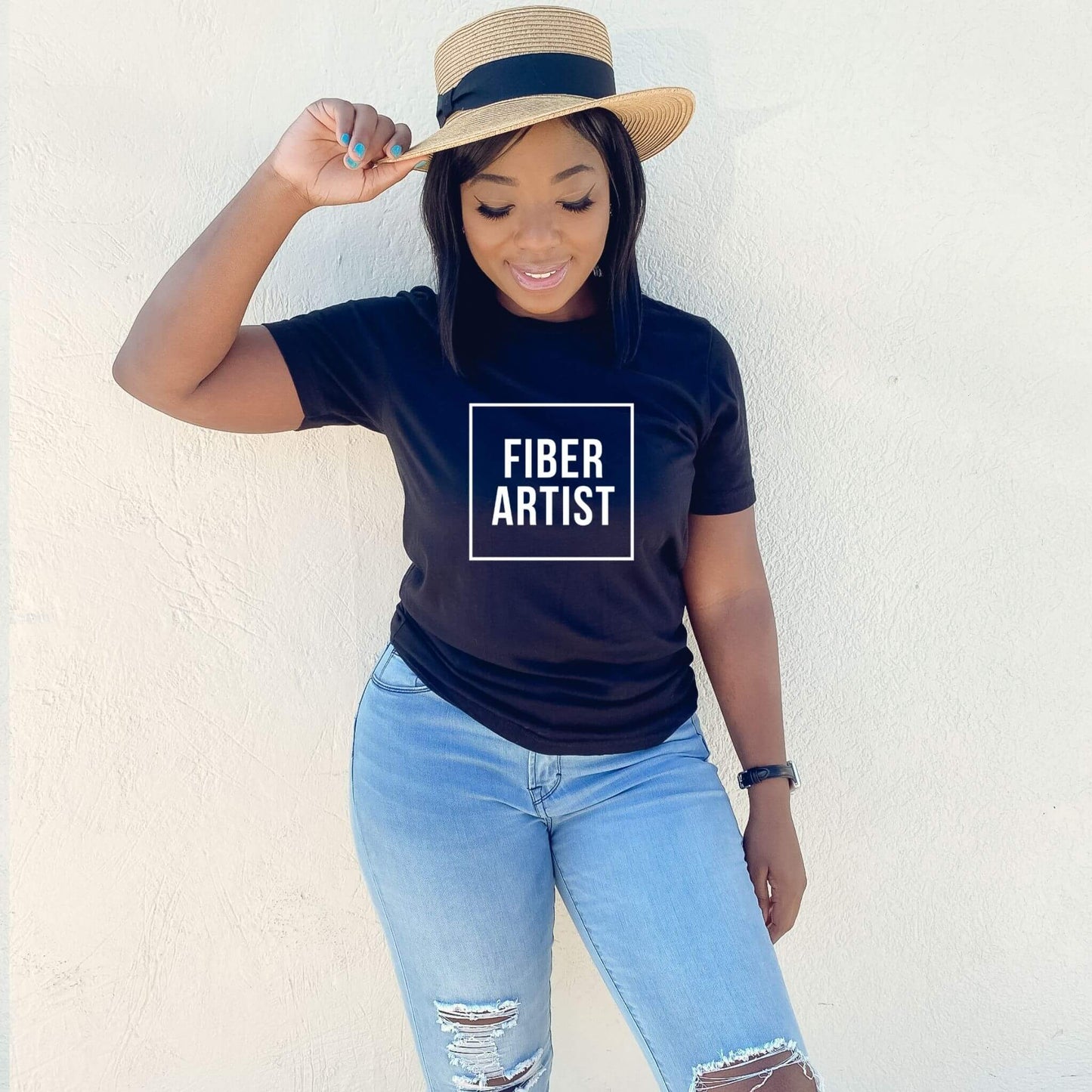 black t-shirt with words fiber artist on it