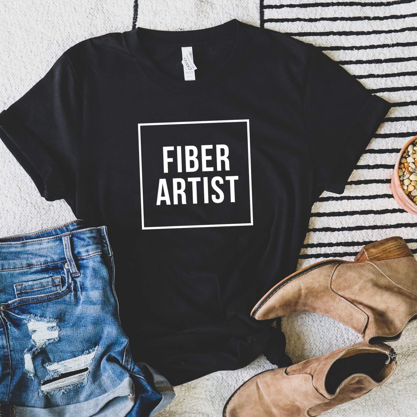 black t-shirt with words fiber artist on it
