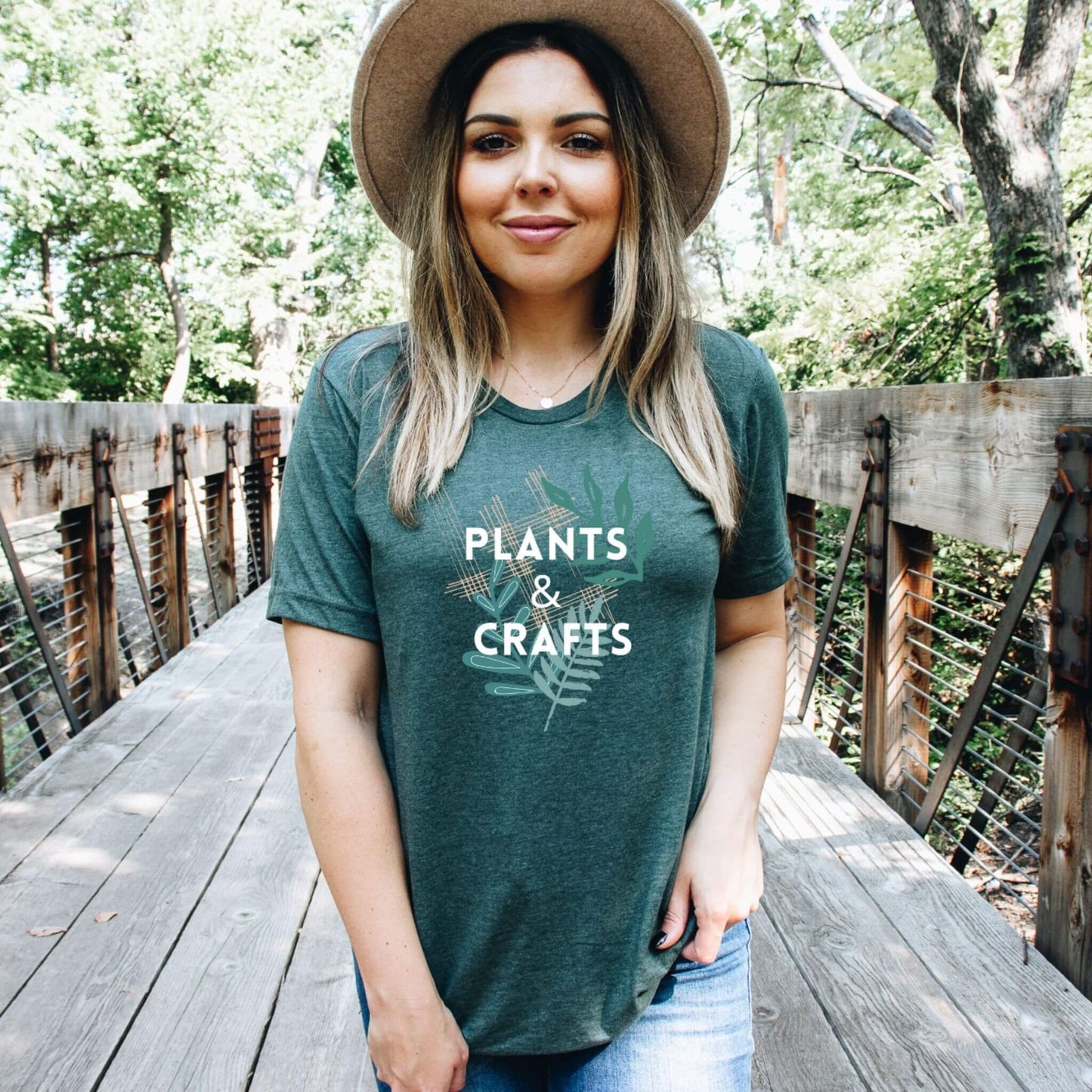 dark heather green t-shirt with words plant and crafts on it